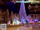 A large christmas tree in the middle of a shopping mall.